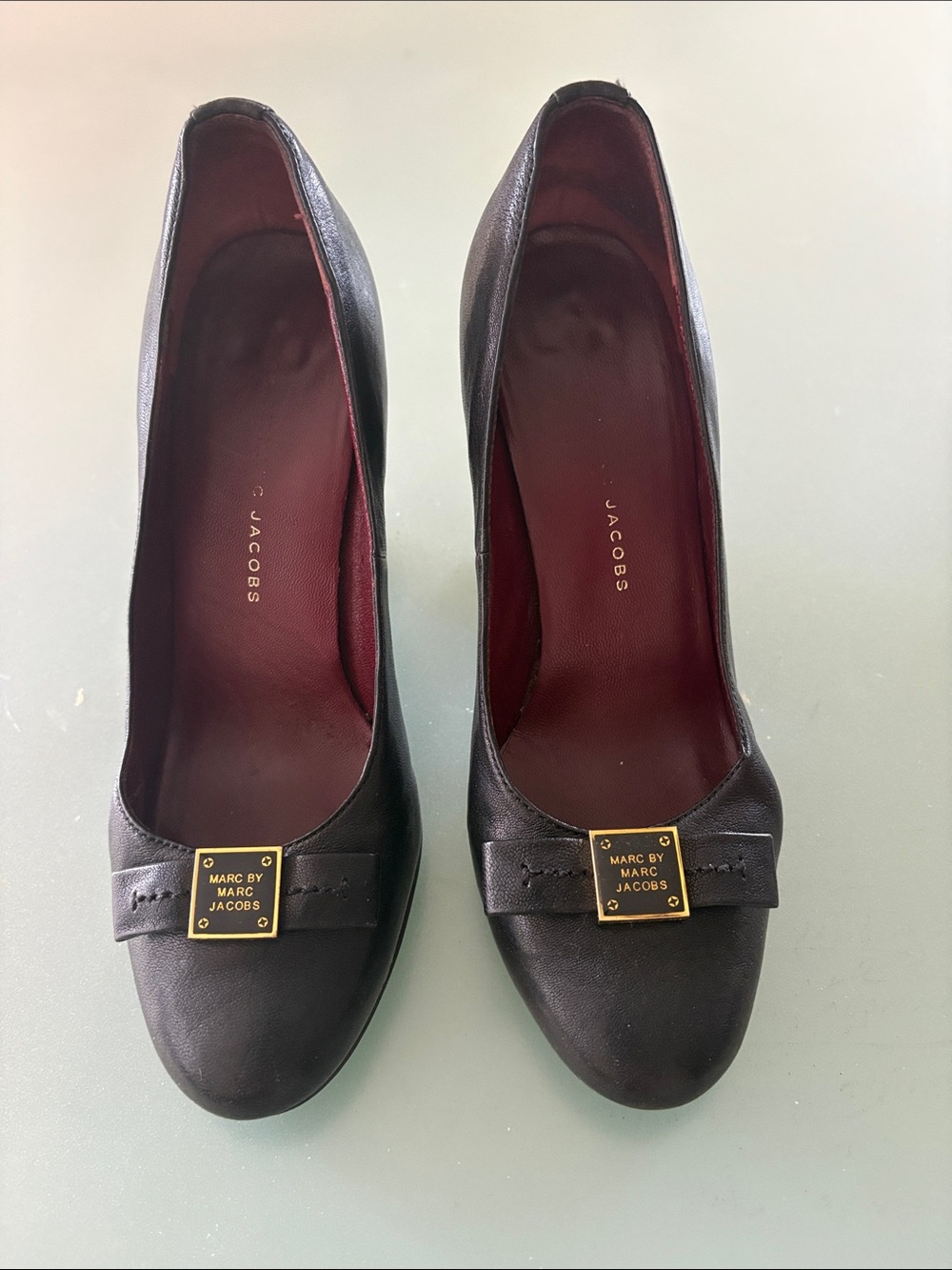Marc by Marc Jacobs Black Leather Bow Pumps with Gold Plaque Accent